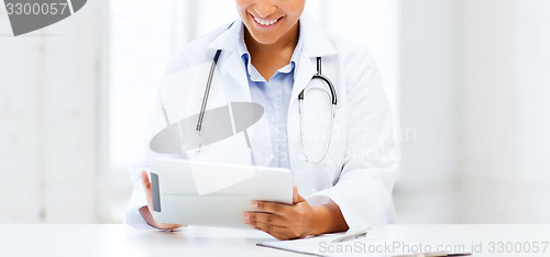 Image of african female doctor with tablet pc