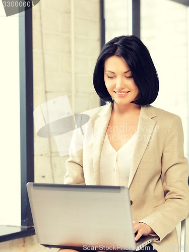 Image of happy woman with laptop computer