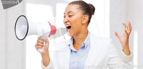 Image of strict businesswoman shouting in megaphone