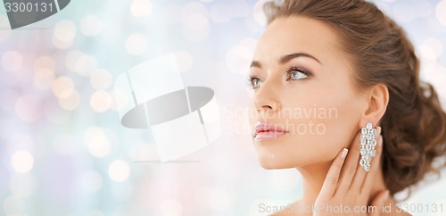 Image of woman with diamond earrings