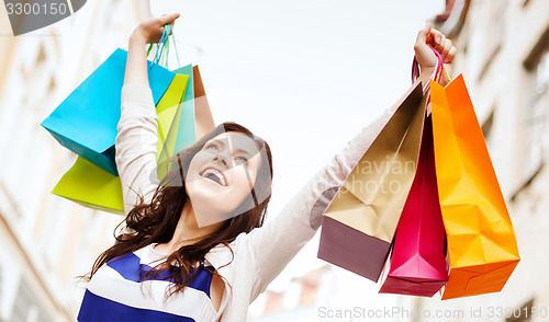 Image of woman with shopping bags in ctiy