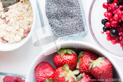 Image of close up of fruits and berries in bowl on table