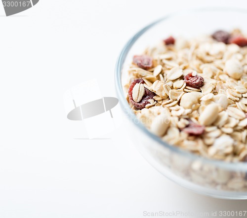 Image of close up of bowl with granola or muesli on table