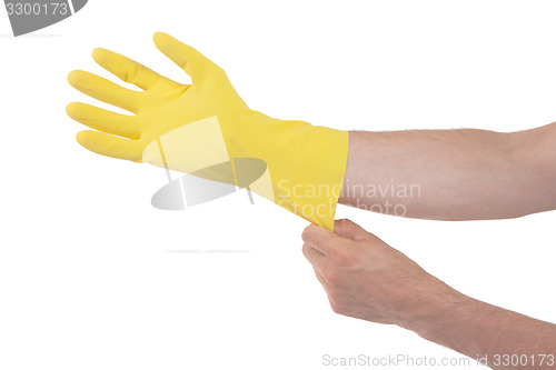 Image of Hand in yellow glove