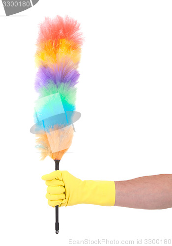 Image of Man with yellow cleaning glove holding a duster