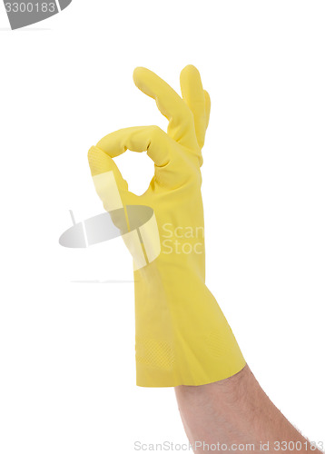 Image of Hand gesturing with yellow cleaning product glove