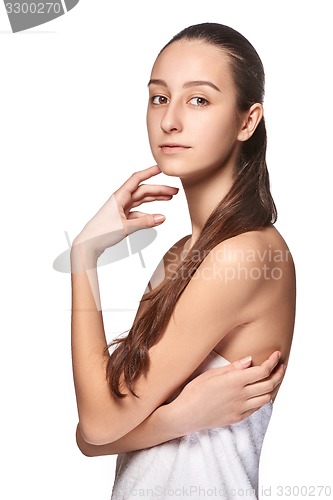 Image of Portrait of beautiful girl stroking her face with healthy skin 