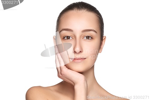 Image of Portrait of beautiful girl stroking her face with healthy skin 