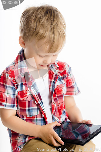 Image of boy with a Tablet PC. studio