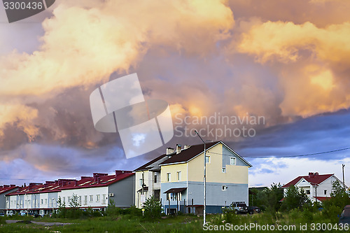 Image of Cottages under cloudy sky