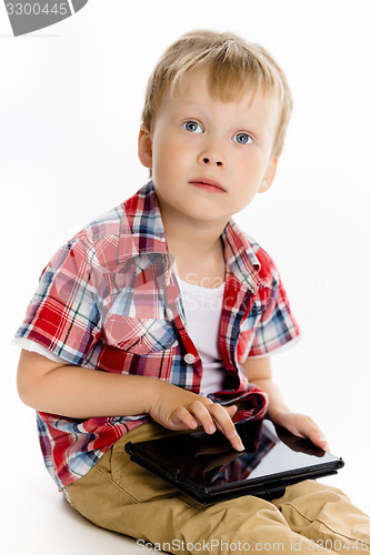 Image of boy with a Tablet PC. studio