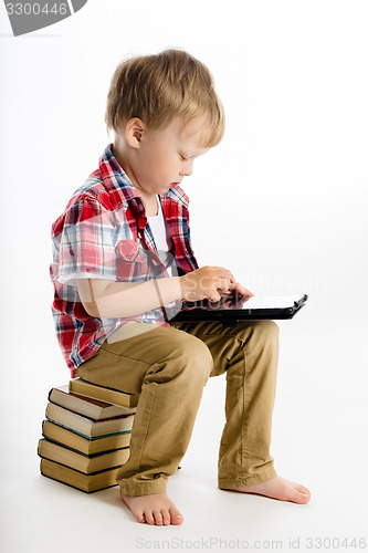 Image of boy with a Tablet PC. studio