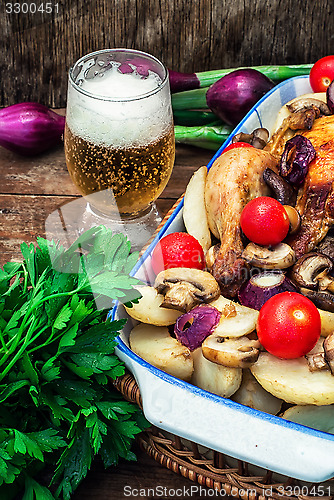 Image of baked whole chicken in vegetables