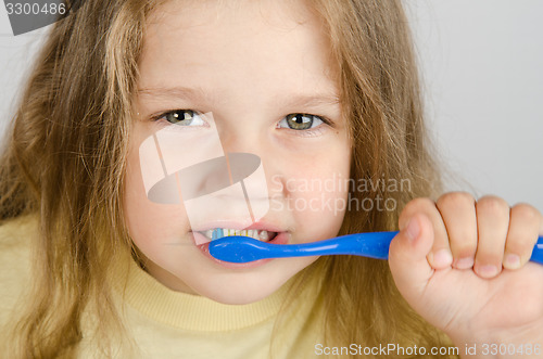 Image of Close-up of a girl cleaning teeth