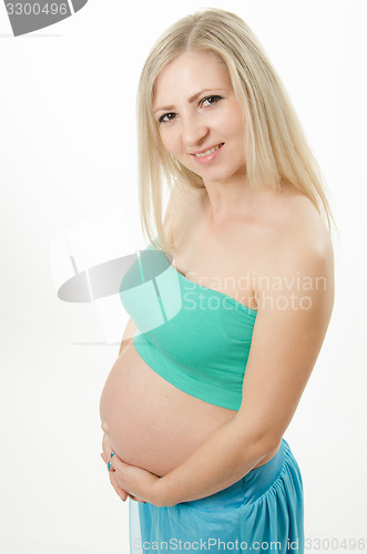 Image of Half-length portrait of a young pregnant girl