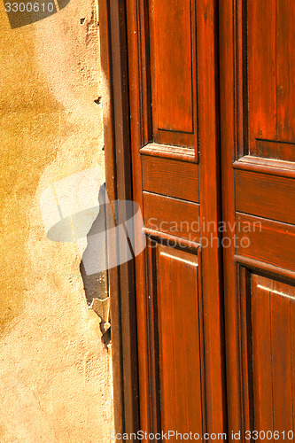 Image of abstract  church door    in italy  lombardy  red