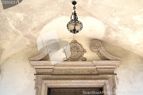 Image of abstract  church door    in italy  lombardy   street lamp