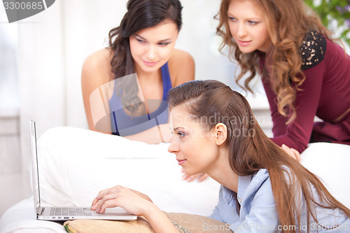 Image of girls and a laptop