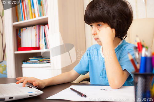 Image of schoolboy doing homework