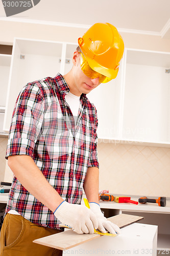 Image of worker makes marks