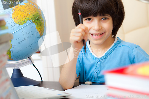 Image of schoolboy doing homework