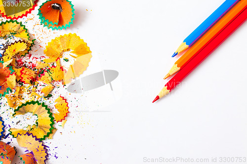 Image of pencils and shavings on white background