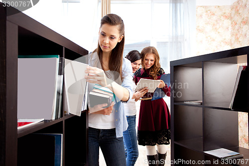 Image of students in a library