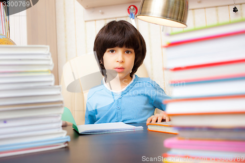 Image of boy reading a book