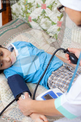 Image of Doctor measure blood pressure