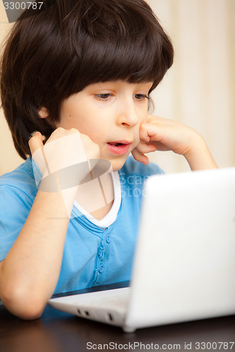 Image of boy with white notebook