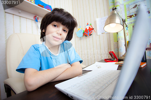 Image of schoolboy doing homework