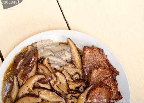 Image of venison deer game filet and wild mushrooms