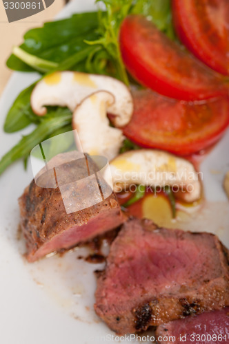 Image of beef filet mignon grilled with vegetables