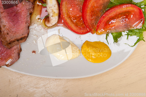 Image of beef filet mignon grilled with vegetables