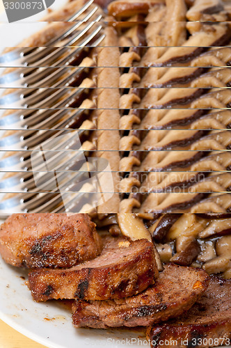 Image of venison deer game filet and wild mushrooms