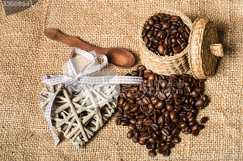 Image of pile of fresh coffee beans, heart