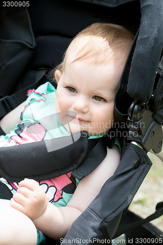 Image of Cute White Blond Baby girl on Stroller