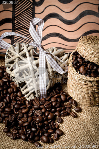 Image of pile of fresh coffee beans, heart