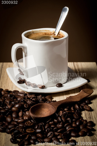 Image of pile of fresh beans, cap, and spoon