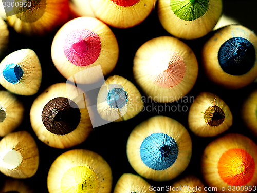 Image of Colorful wooden crayons closely.