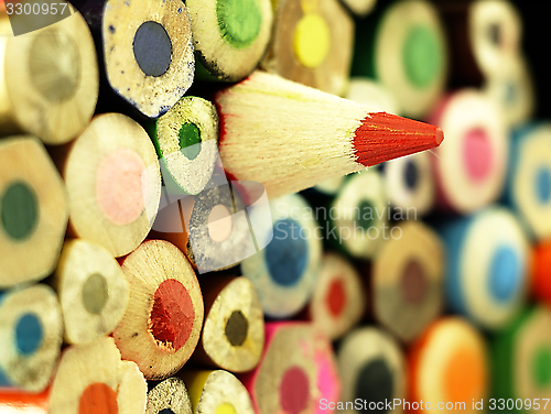 Image of Colorful wooden crayons closely.