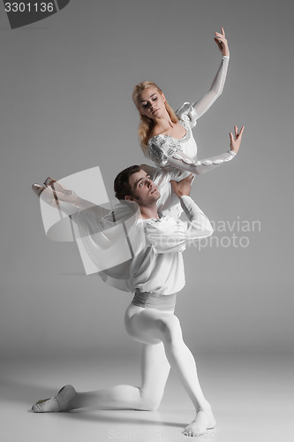 Image of Two young ballet dancers practicing. attractive dancing performers  in white 