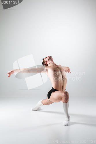 Image of The young attractive modern ballet dancer on white background