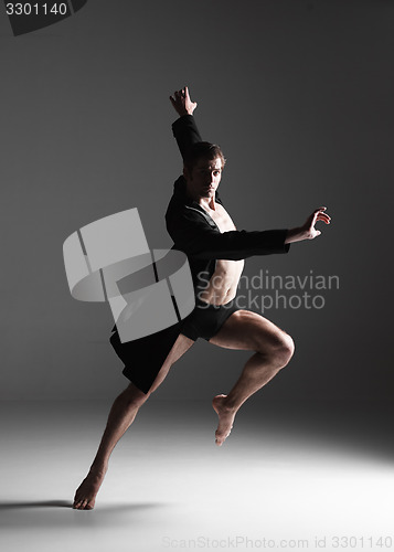 Image of The young attractive modern ballet dancer on white background