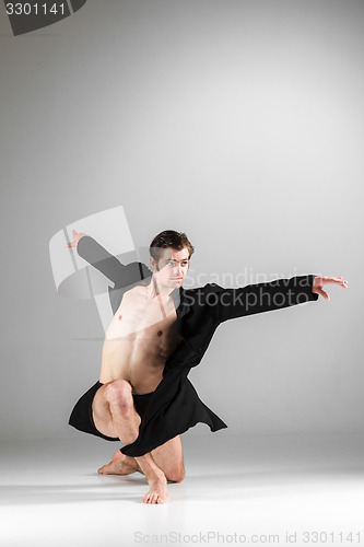 Image of The young attractive modern ballet dancer on white background