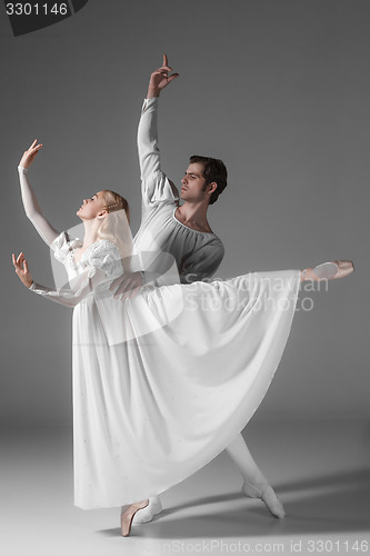 Image of Two young ballet dancers practicing. attractive dancing performers  in white 