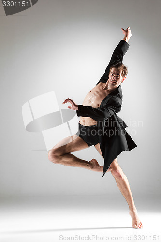 Image of The young attractive modern ballet dancer on white background