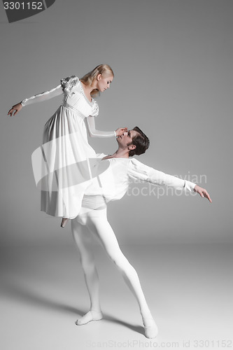 Image of Two young ballet dancers practicing. attractive dancing performers  in white 