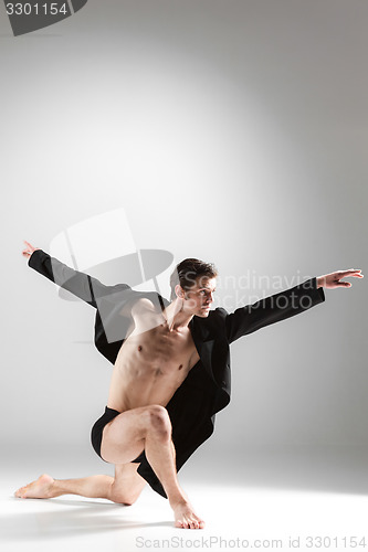 Image of The young attractive modern ballet dancer on white background