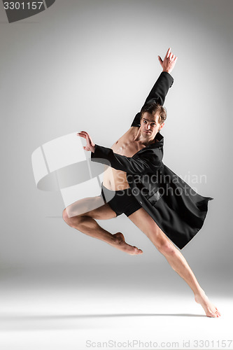 Image of The young attractive modern ballet dancer on white background